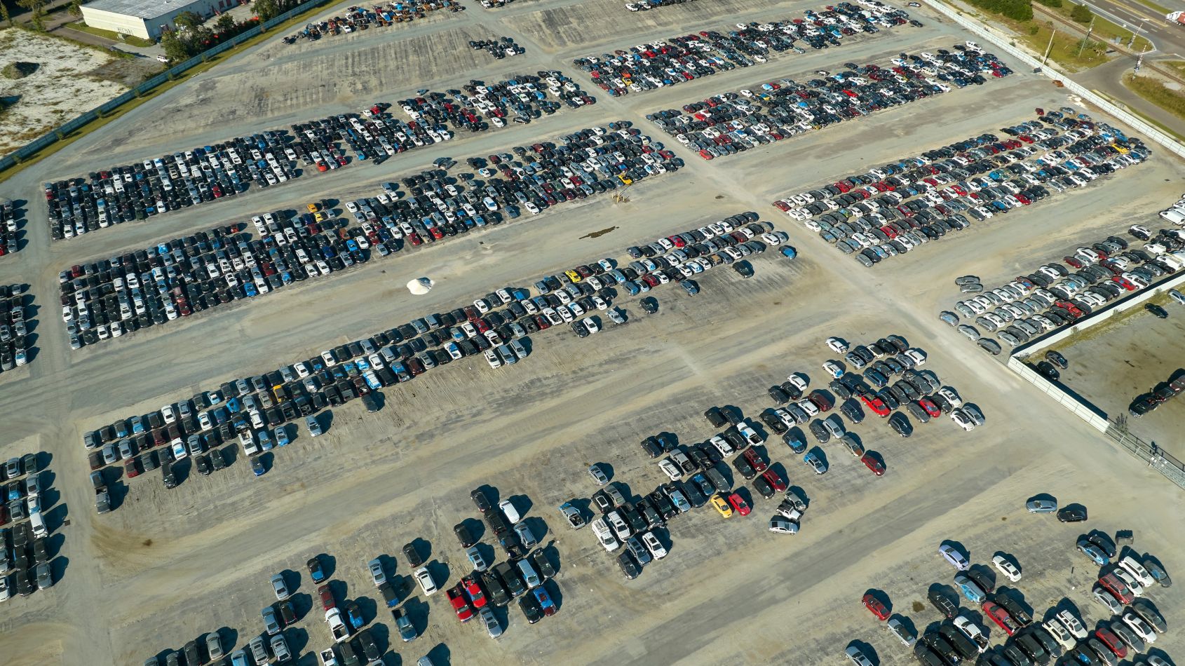 Aerial view of a vehicle remarketing lot — fleet disposal in Europe